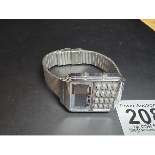 208 - A vintage digital calculator watch by Saxon, the watch is in excellent clear condition with a metal ... 