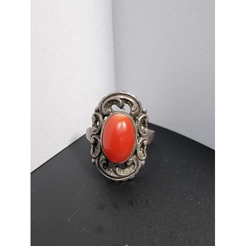 210 - A good genuine vintage sterling silver art deco ring inset with a large natural red coral cabochon s... 