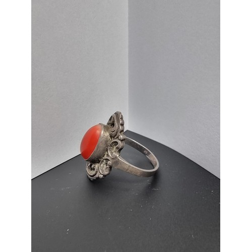 210 - A good genuine vintage sterling silver art deco ring inset with a large natural red coral cabochon s... 