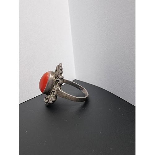 210 - A good genuine vintage sterling silver art deco ring inset with a large natural red coral cabochon s... 