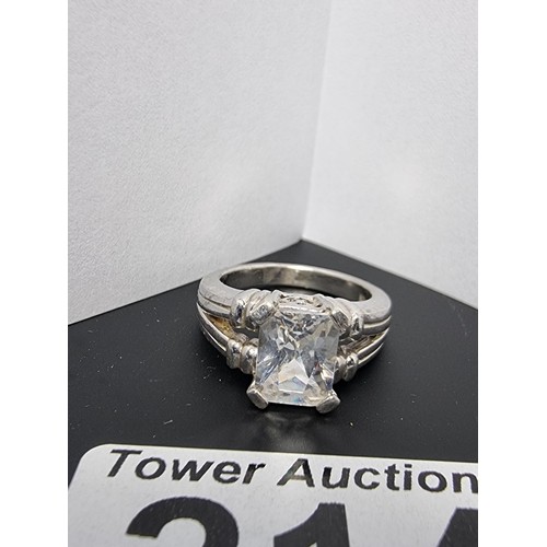 214 - A good quality ornate 925 silver dress ring inset with a large faceted rectangular cz crystal stone ... 