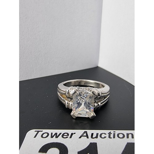 214 - A good quality ornate 925 silver dress ring inset with a large faceted rectangular cz crystal stone ... 