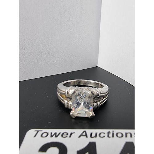 214 - A good quality ornate 925 silver dress ring inset with a large faceted rectangular cz crystal stone ... 