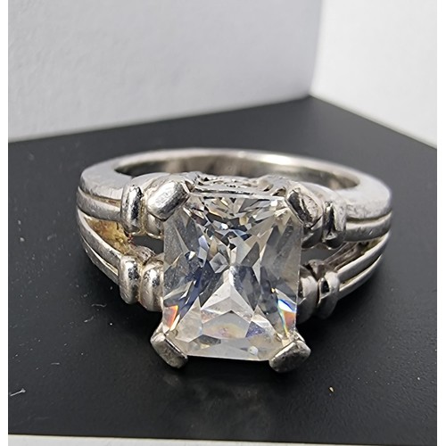 214 - A good quality ornate 925 silver dress ring inset with a large faceted rectangular cz crystal stone ... 