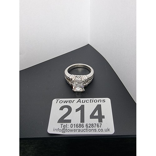 214 - A good quality ornate 925 silver dress ring inset with a large faceted rectangular cz crystal stone ... 