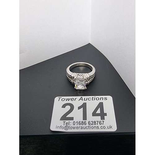 214 - A good quality ornate 925 silver dress ring inset with a large faceted rectangular cz crystal stone ... 