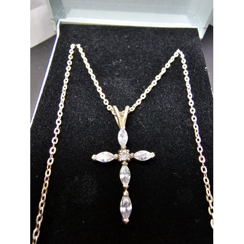 217 - A pretty 925 silver cross pendant inset with genuine iolite gemstones set on an 18