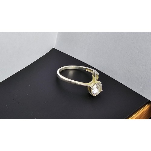 220 - A pretty 925 silver solitaire ring inset with a large faceted crystal CZ stone which is very sparkly... 