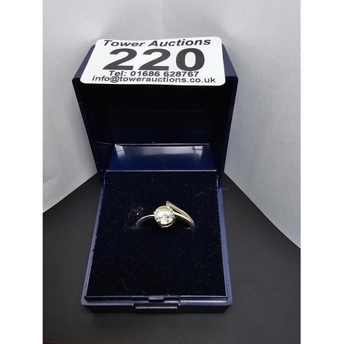 220 - A pretty 925 silver solitaire ring inset with a large faceted crystal CZ stone which is very sparkly... 