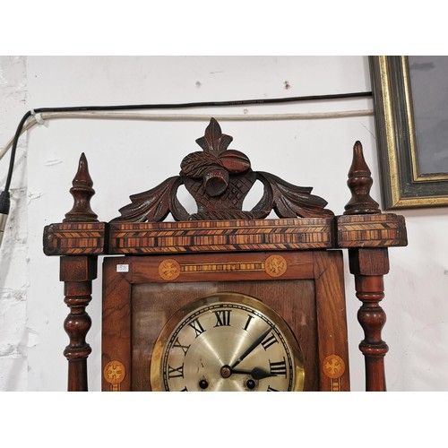 134 - A good quality vintage Vienna wall clock, with detailed inlay to the front and carved acorn and leaf... 