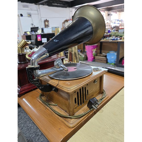 344 - An attractive reproduction classic home phonograph with a large brass horn the music player features... 