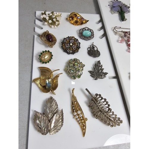 347 - Suite of various costume brooches on two display boards (not included) includes some good leaf form ... 