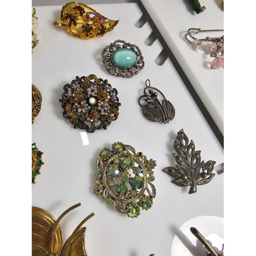 347 - Suite of various costume brooches on two display boards (not included) includes some good leaf form ... 