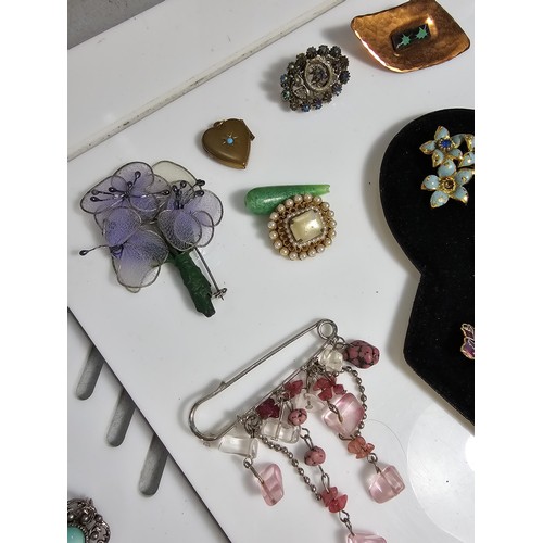 347 - Suite of various costume brooches on two display boards (not included) includes some good leaf form ... 