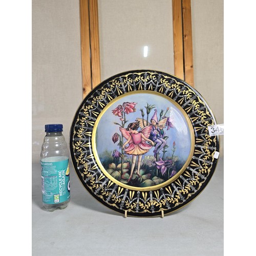 348 - Heavy large and impressive ironstone charger by Victoria ware which features an attractive a fairy a... 