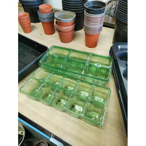 363 - Crate containing a large quantity of plastic garden pots of various sizes along with trays