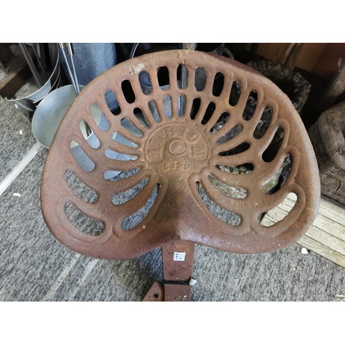 377 - Antique Cast Iron Albion Tractor seat ideal for re-purposing marked 5329, seat has a diameter of 33c... 