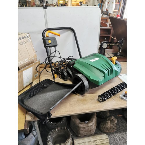 378 - New in box 1500w garden rake and scarifier in good order complete with manual and accessories