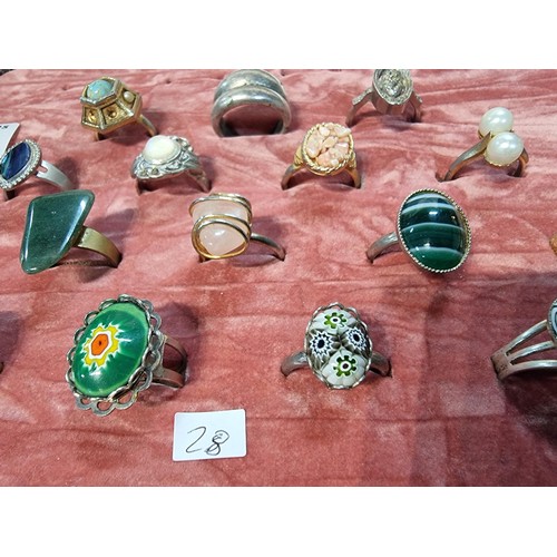 328 - A collection of 16x ornate dress rings rings feature semi precious stones, art glass deigns etc disp... 