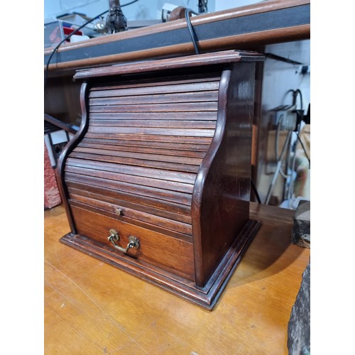 333 - Nice quality antique table top roll top desk in solid mahogany  the roll top is in good order and fu... 