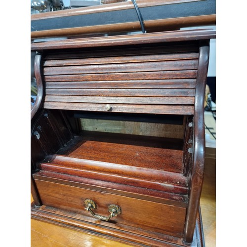 333 - Nice quality antique table top roll top desk in solid mahogany  the roll top is in good order and fu... 