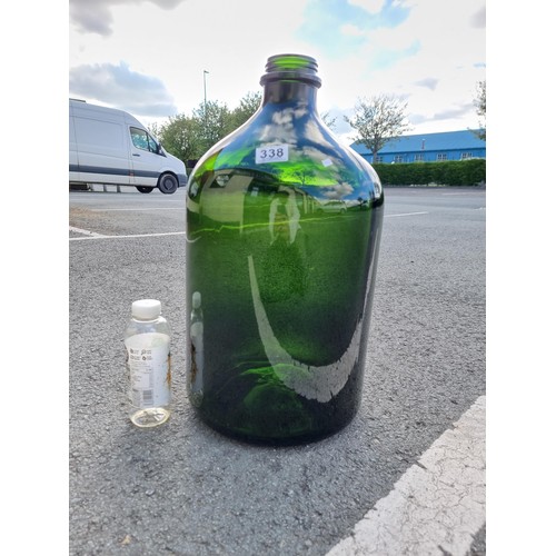 338 - Vary large and impressive green glass demi-john style bottle this bottle is 54cm high and diameter 2... 