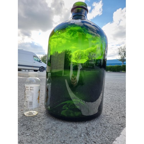 338 - Vary large and impressive green glass demi-john style bottle this bottle is 54cm high and diameter 2... 