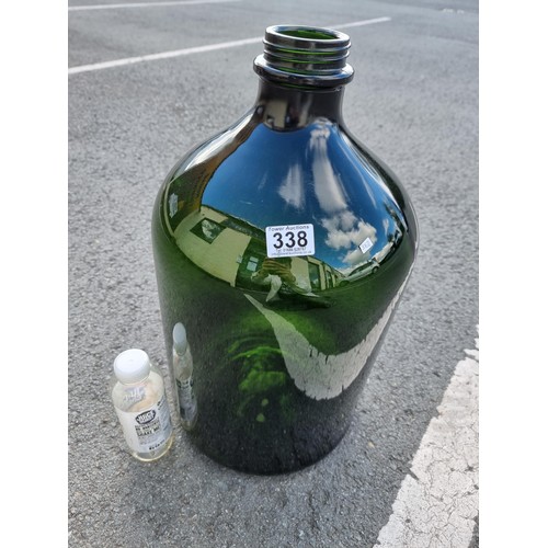 338 - Vary large and impressive green glass demi-john style bottle this bottle is 54cm high and diameter 2... 