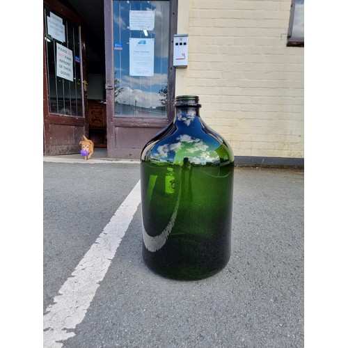 338 - Vary large and impressive green glass demi-john style bottle this bottle is 54cm high and diameter 2... 