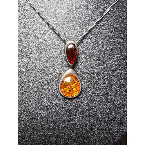 230 - Vintage 925 silver pendant inset with two types of natural amber which is orange and red set on a 18... 