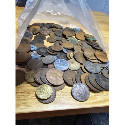 267 - A large bag of various coins which mostly consists of British copper coins along with some world coi... 