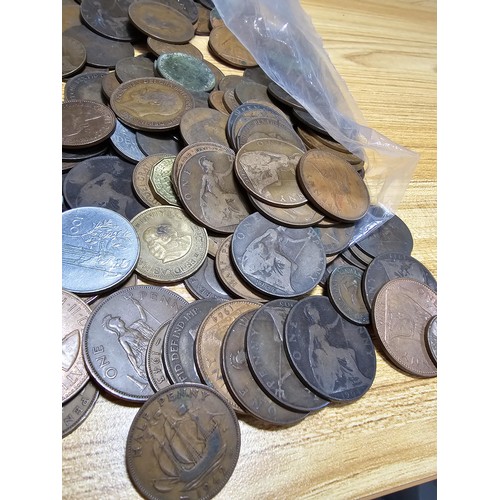 267 - A large bag of various coins which mostly consists of British copper coins along with some world coi... 