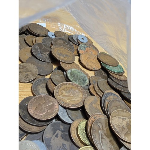 267 - A large bag of various coins which mostly consists of British copper coins along with some world coi... 