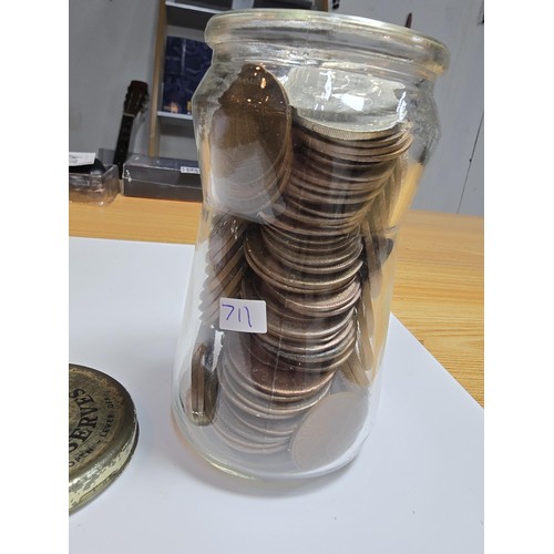 268 - A glass jar full of various British copper coins.