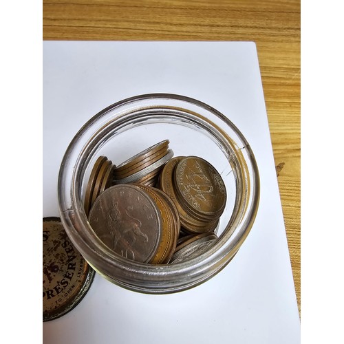 268 - A glass jar full of various British copper coins.