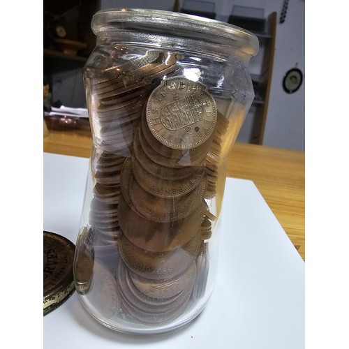 268 - A glass jar full of various British copper coins.