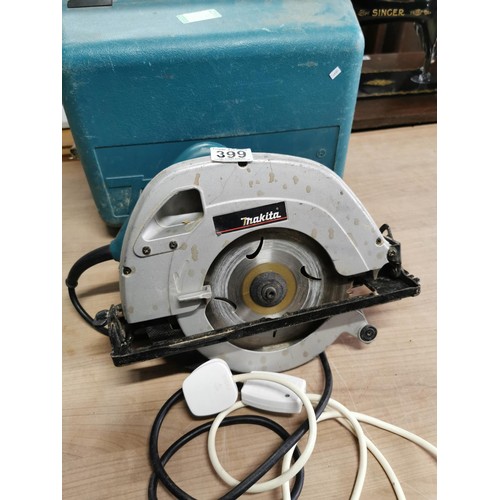 399 - A Makita PAT tested steel saw 570 4R complete with case