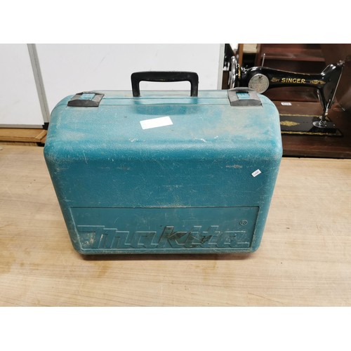 399 - A Makita PAT tested steel saw 570 4R complete with case