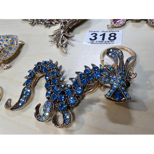 318 - A collection of 5x large ornate jewelled keyrings to include a parrot, dragon and peacock keyring, e... 