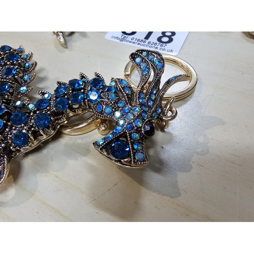 318 - A collection of 5x large ornate jewelled keyrings to include a parrot, dragon and peacock keyring, e... 