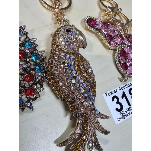 318 - A collection of 5x large ornate jewelled keyrings to include a parrot, dragon and peacock keyring, e... 