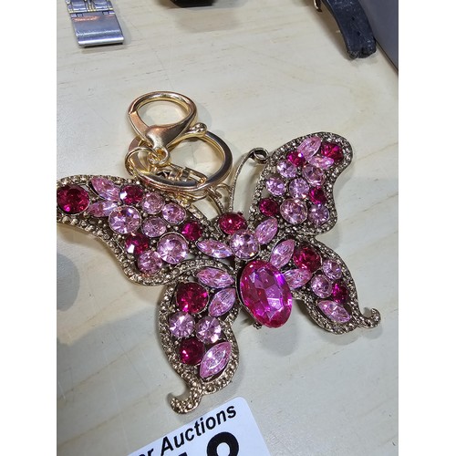 318 - A collection of 5x large ornate jewelled keyrings to include a parrot, dragon and peacock keyring, e... 