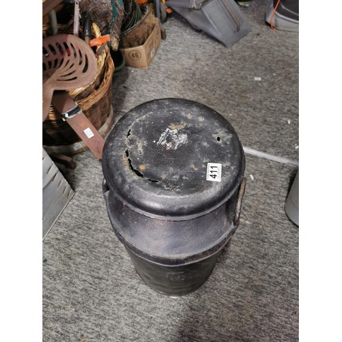 411 - Vintage metal milk churn painted black complete with lid, lid has hole in the top stands at 77cm hig... 