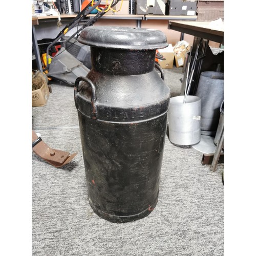 411 - Vintage metal milk churn painted black complete with lid, lid has hole in the top stands at 77cm hig... 