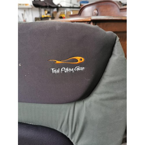 415 - A good quality Total Fishing Gear fishing chair, padded in good order, folds down flat has adjustabl... 