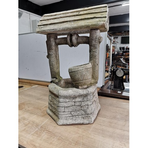 417 - Good quality well detailed wishing well formed concrete planter in good order roof and stand come of... 