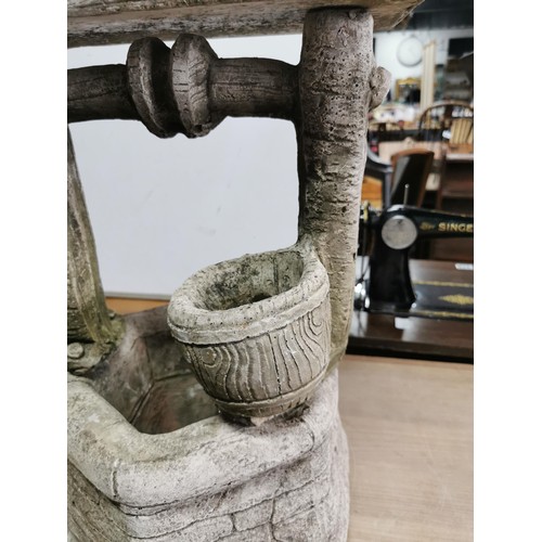 417 - Good quality well detailed wishing well formed concrete planter in good order roof and stand come of... 