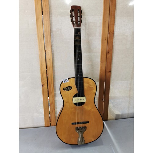 145 - A good quality Martin Collette acoustic guitar in good order with fitted pickup.