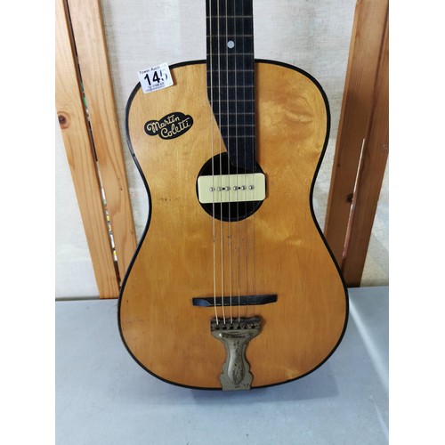 145 - A good quality Martin Collette acoustic guitar in good order with fitted pickup.