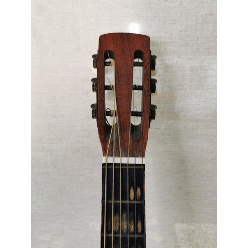 145 - A good quality Martin Collette acoustic guitar in good order with fitted pickup.